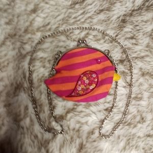 1989 Place cute little coin purse on a chain